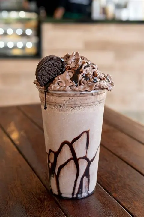 Rich chocolate protein milkshake in a glass